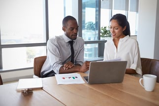 Businesspeople-Working-On-Laptop-In-Boardroom-Together-677893494_4852x3235