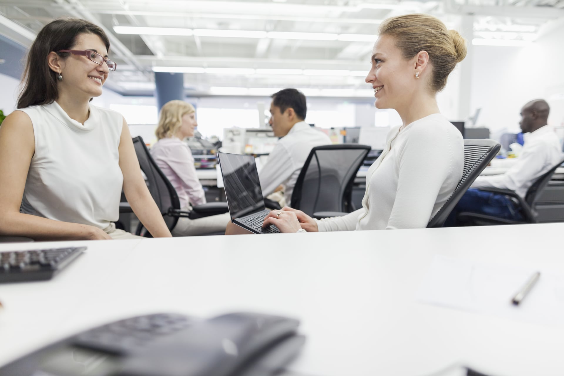 women-talking-together-in-office